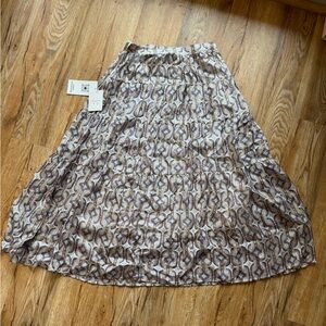 Aman shar skirt color brown\gold 
Brand new with tag 
USA women size small